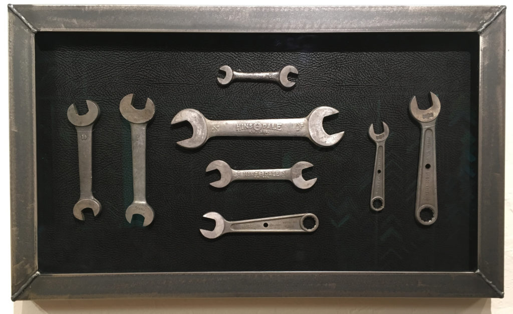 Shadowbox displaying collection of wrenches